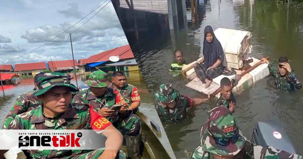 Babinsa Kodim 1315-02/Limboto Gerak Cepat Evakuasi Warga Terdampak Banjir di Kelurahan Kayubulan