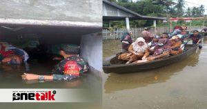 Babinsa Kodim 1315-02/Limboto Evakuasi Warga Korban Banjir di Kelurahan Hunggaluwa